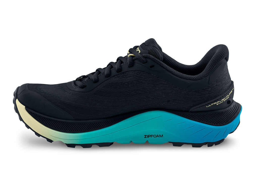Women's Topo Ultraventure 4. Black upper. Blue/Green midsole. Medial view.