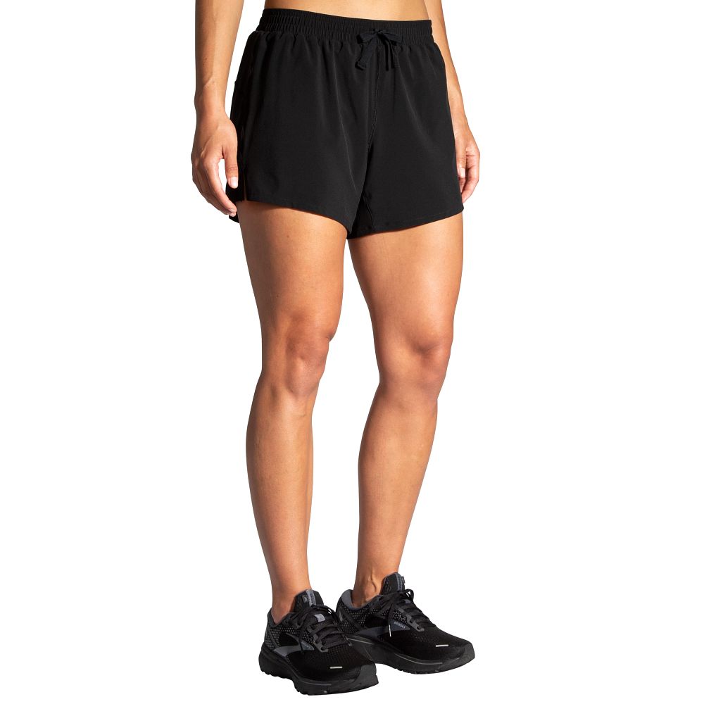 Women's Brooks Moment 5" Shorts. Black. Front/Lateral view.