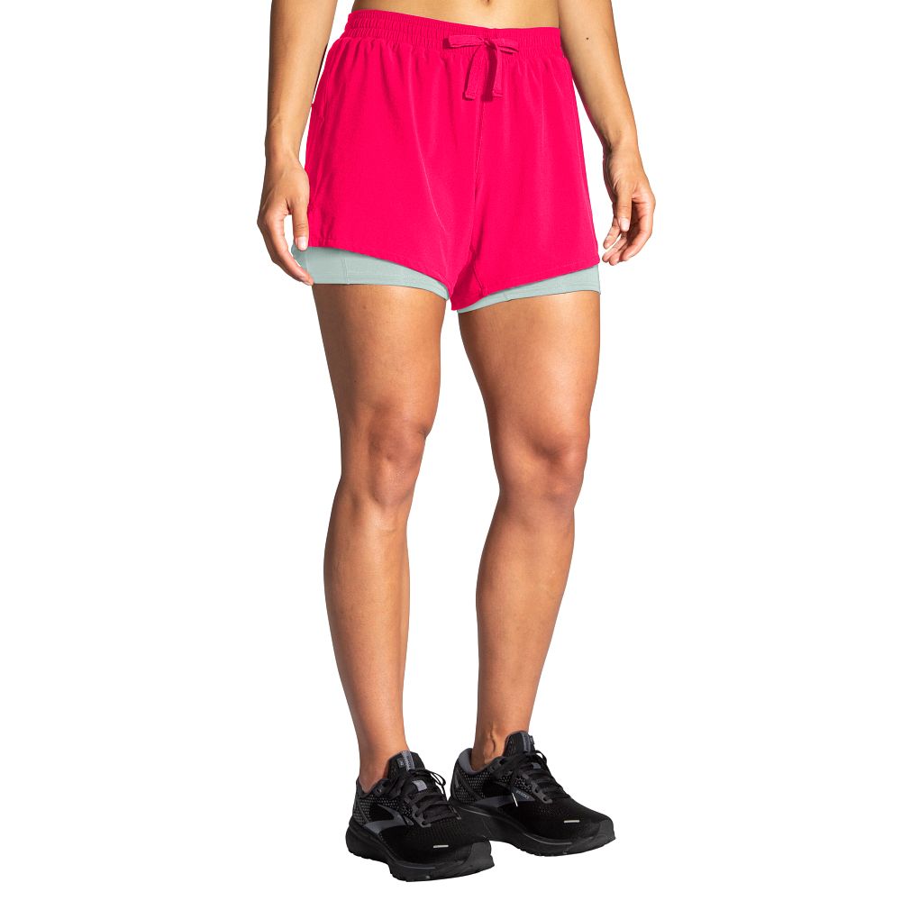 Women's Brooks Moment 5" 2-in-1 Shorts. Pink. Front view.