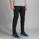 Men's Brooks Spartan Pants. Black. Front/Lateral view.