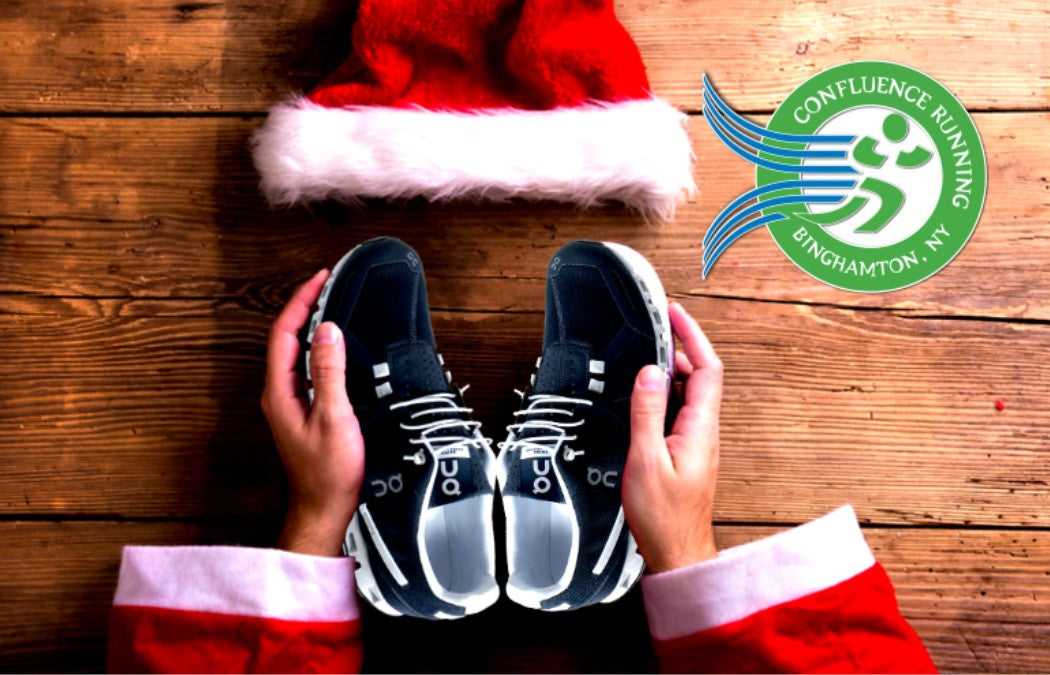 a gift card with a santa hat and a pair of sneakers