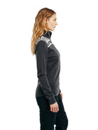 Side worn view of the Cortina women's base layer in Dark Charcoal/Off White
