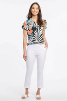 Tribal women's Pull-On Capris in White, full outfit view showing cuffed cropped length.