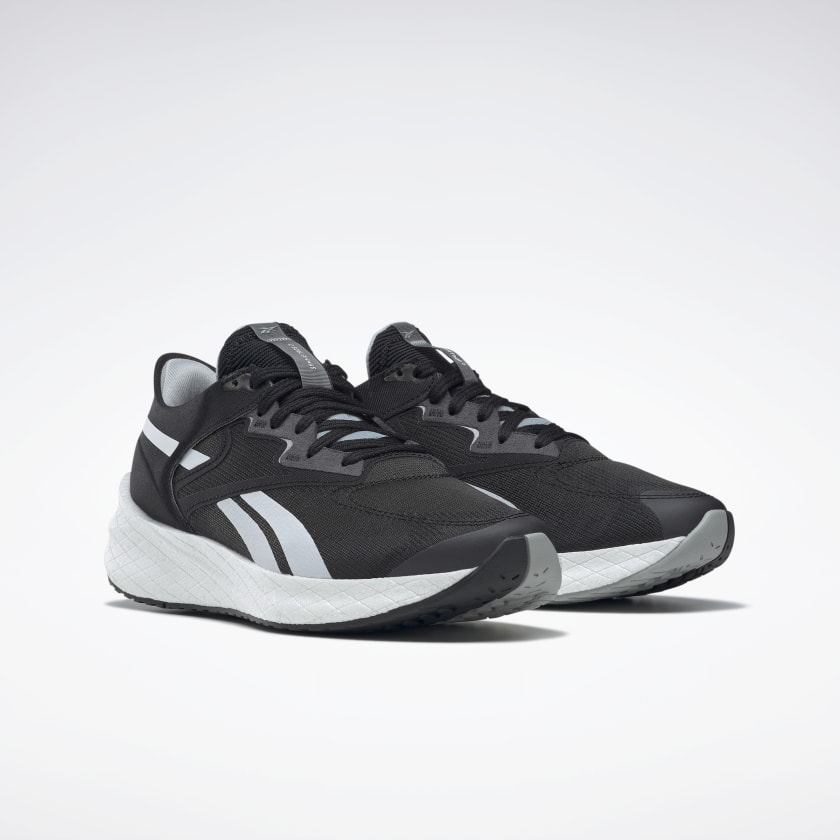 Men's Reebok Floatride Energy Symmetros 2. Black upper. White midsole. Lateral view.
