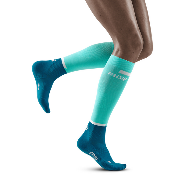 Women's CEP The Run 4.0 Compression Socks. Green/Blue. Lateral view.