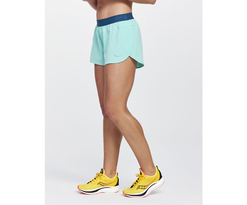 Women's Saucony Outpace Shorts. Light Green. Front/Lateral view.