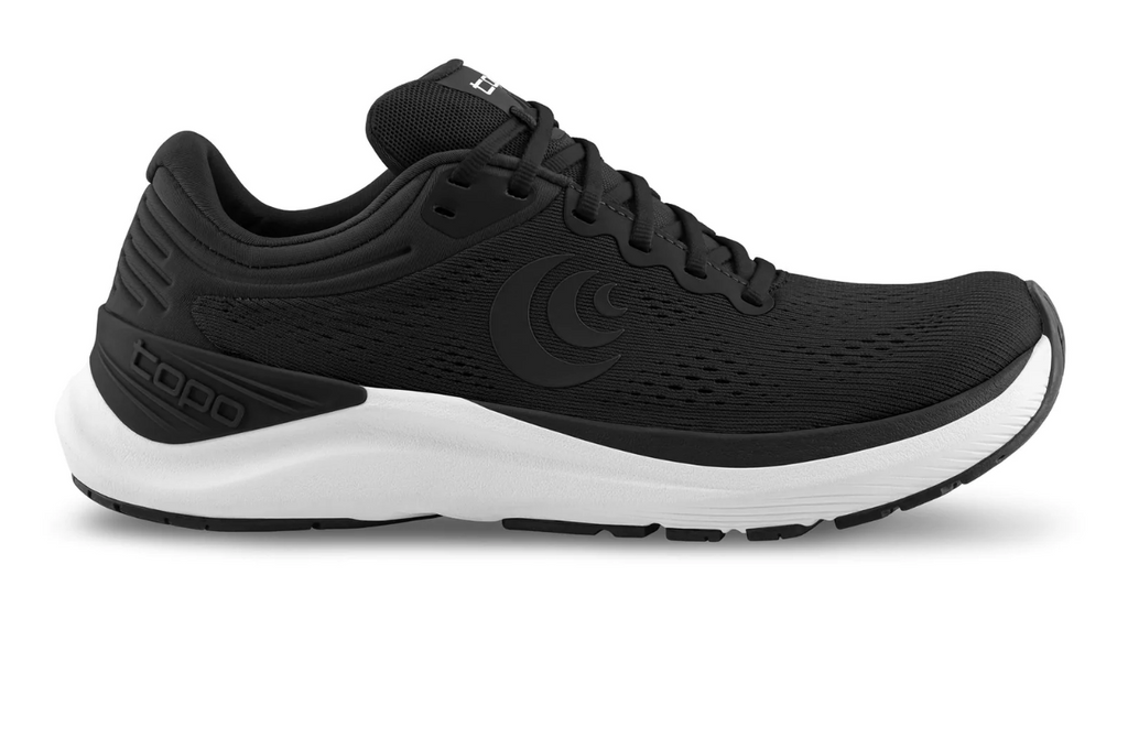 Women's Topo Athletic Ultrafly 4. Black upper. White midsole. Lateral view.