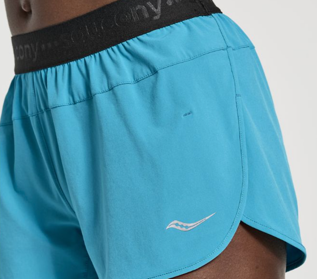 Women's Saucony Outpace Shorts. Green/Blue. Front view.