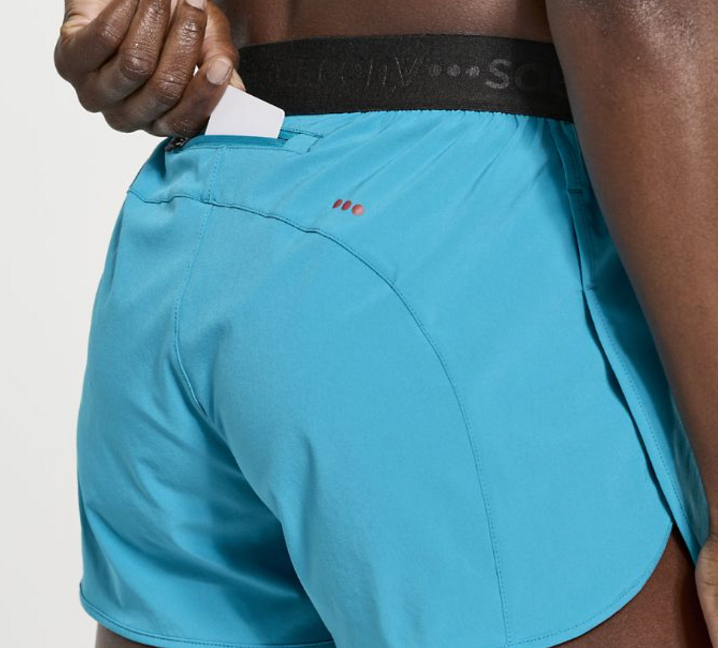Women's Saucony Outpace Shorts. Green/Blue. Rear pocket closeup.