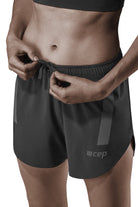 Women's CEP Race Loose Fit Shorts. Black. Front view.