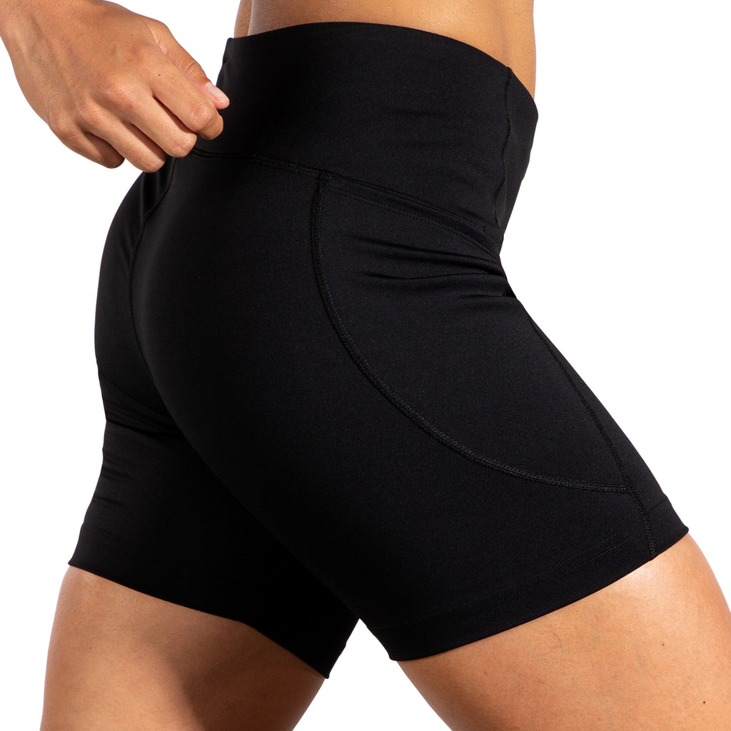 Women's Brooks Moment 5" Short Tights. Black. Lateral view.
