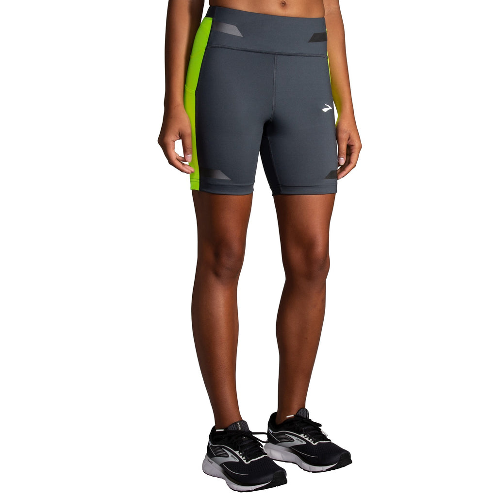 Women's Brooks Run Visible 6" Short Tights. Dark Grey/Yellow. Front/Lateral view.