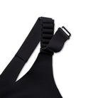 Women's Brooks Dare Racerback Run Bra 2.0. Black. Strap closeup view.