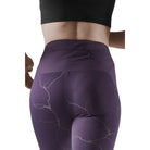 Women's CEP Reflective Tights. Purple. Rear view.