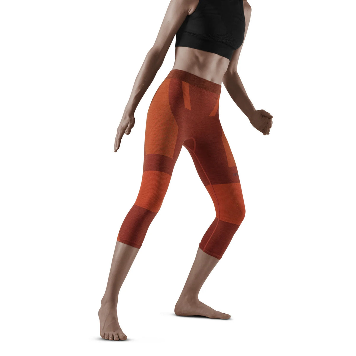 Women's CEP Ski Tights. Dark Orange. Front/Lateral view.