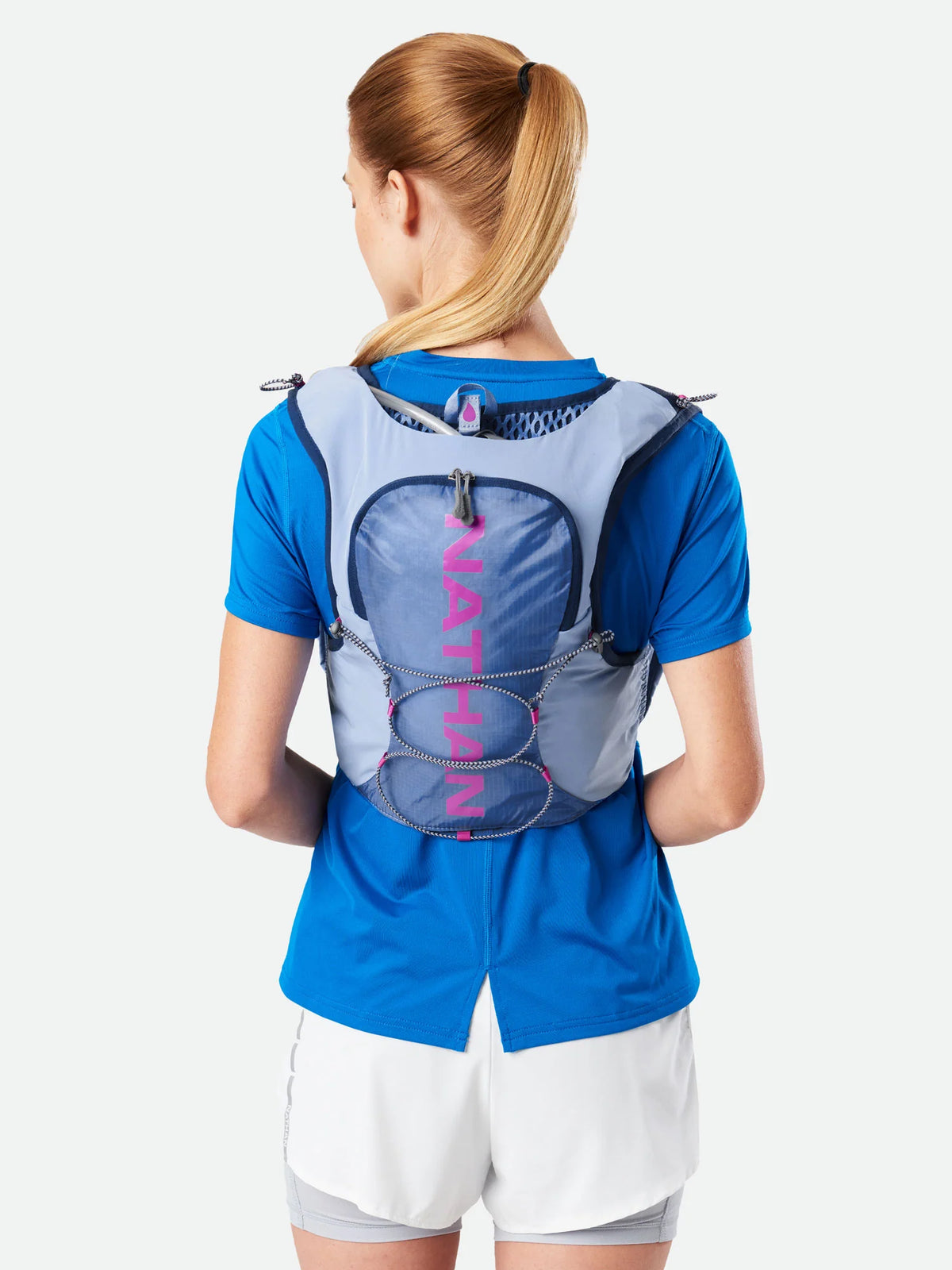 Women's Nathan Vapor Airess 3.0 7 Liter Hydration Vest. Light Blue. Rear view.
