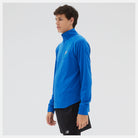 Men's New Balance Heat Grid Half-Zip. Blue. Lateral view.