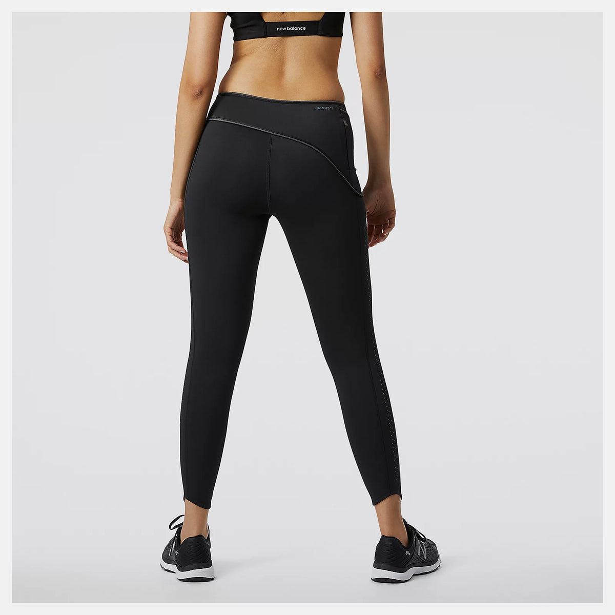 Women's New Balance PMV Kimbia Tights. Black. Rear view.