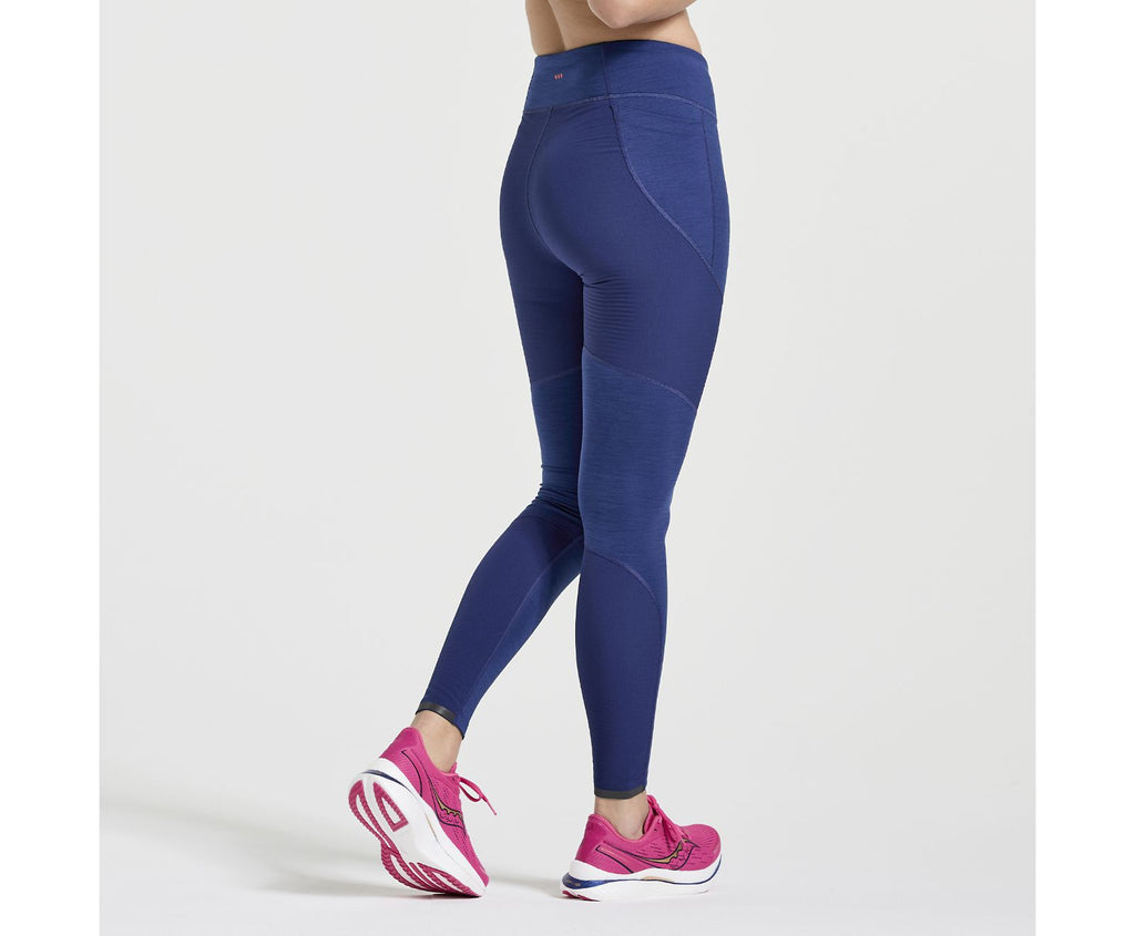 Women's Saucony Boulder Wind Tights. Blue. Rear view.