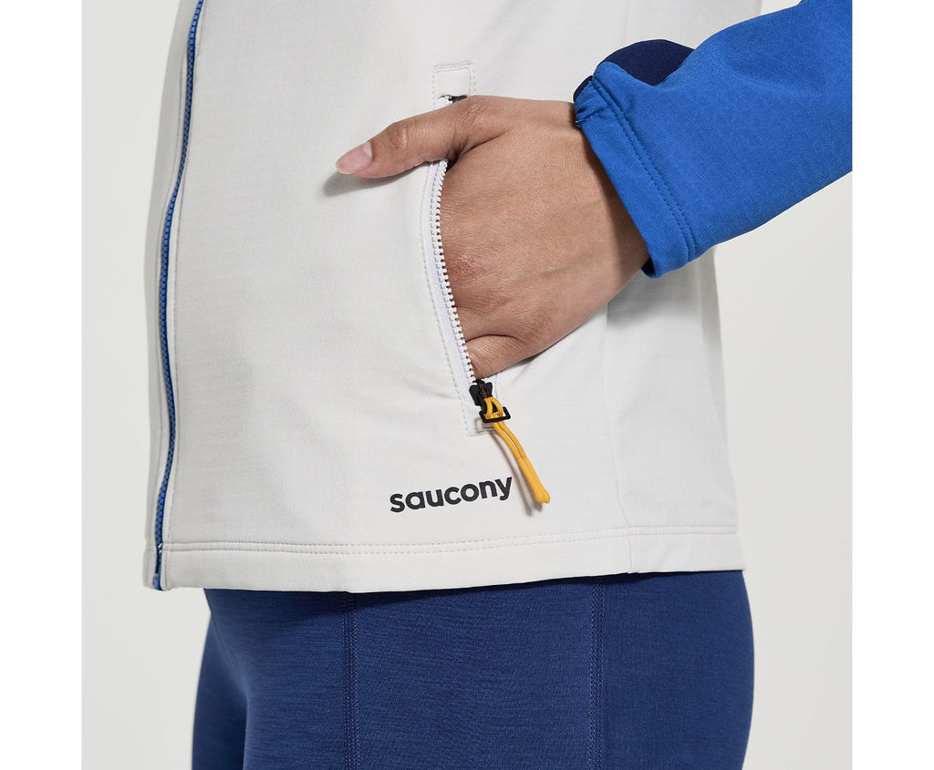 Women's Saucony Bluster Jacket. Blue/White. Pocket closeup.