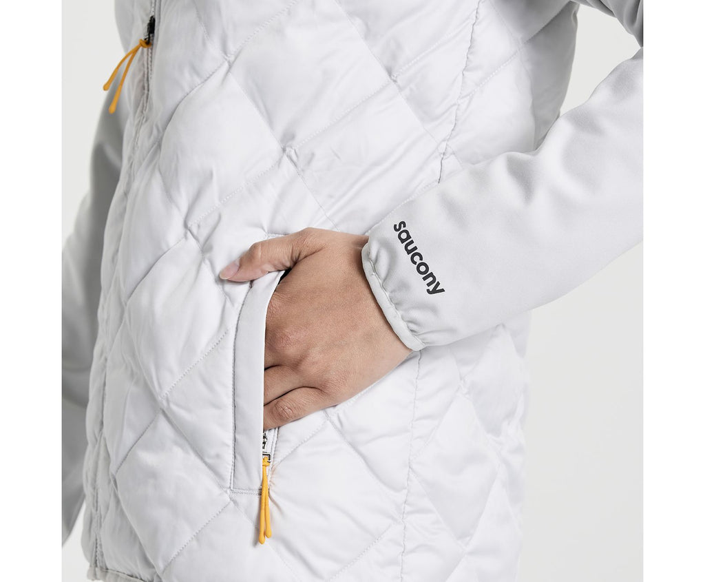 Women's Saucony Oysterpuff Jacket. White. Pocket closeup.