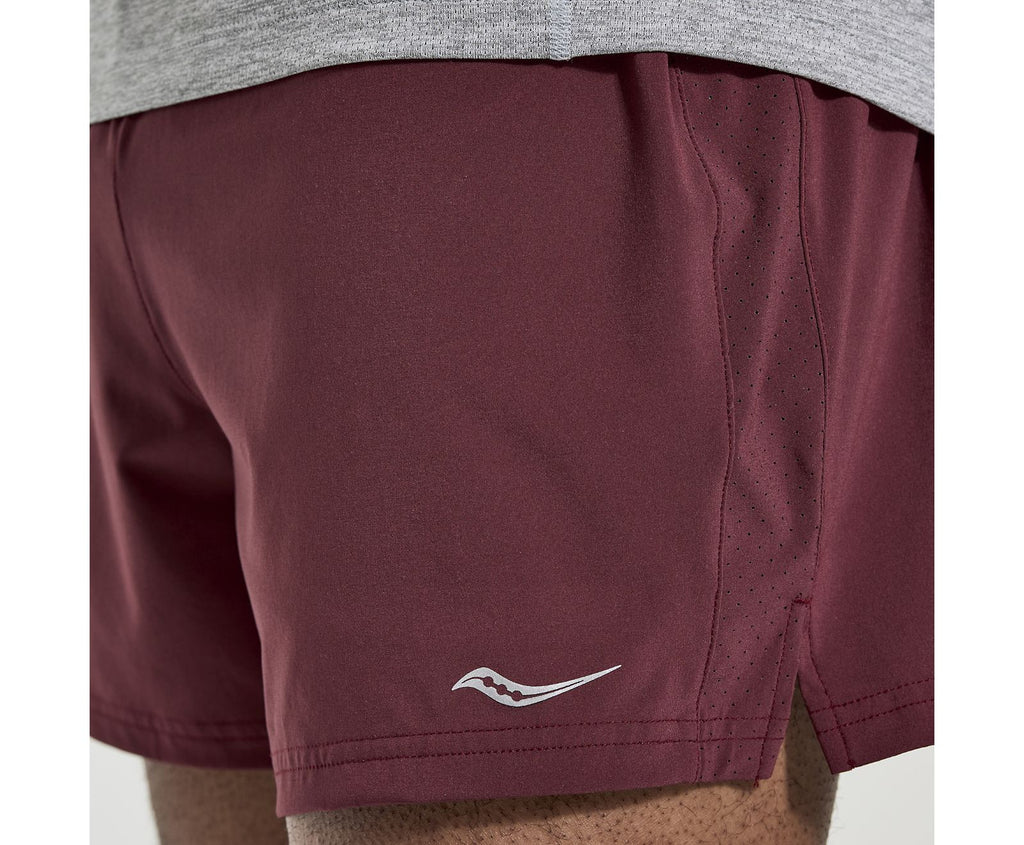 Men's Saucony Outpace Shorts. Red/Grey. Front closeup.