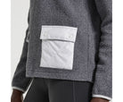 Women's Saucony Rested Sherpa 1/4 Zip. Grey. Pocket closeup.