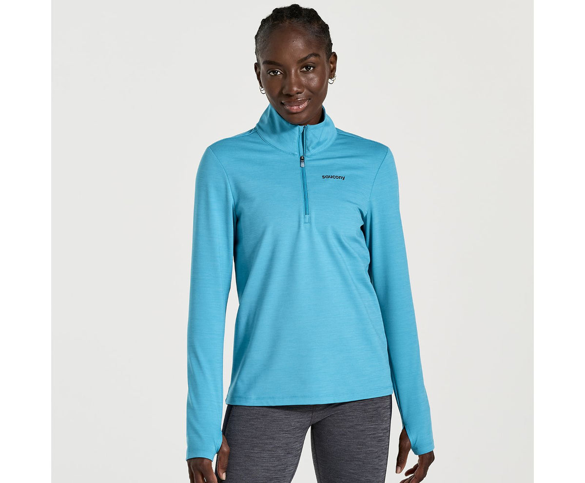 Women's Saucony Solstice 1/4 zip. Blue. Front view.