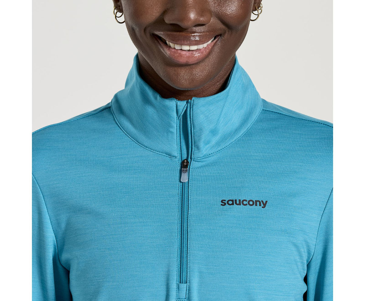 Women's Saucony Solstice 1/4 zip. Blue. Front view.