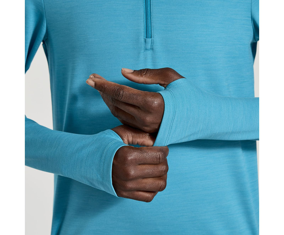 Women's Saucony Solstice 1/4 zip. Blue. Front view.