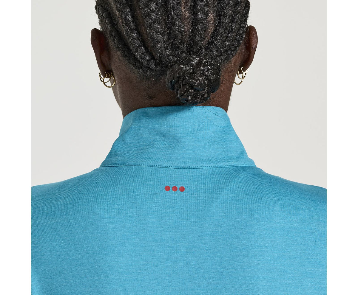 Women's Saucony Solstice 1/4 zip. Blue. Rear view.