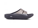 Oofos Ooahh Luxe Slide. Tan upper. Black midsole. Lateral view.